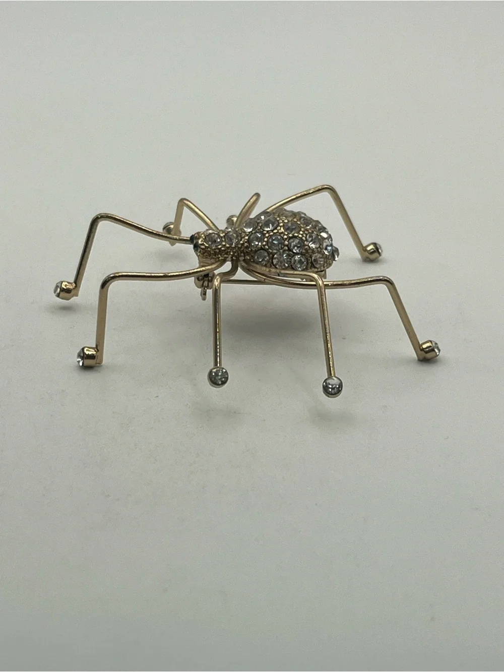 Spider insect gold tone clear rhinestone brooch pin